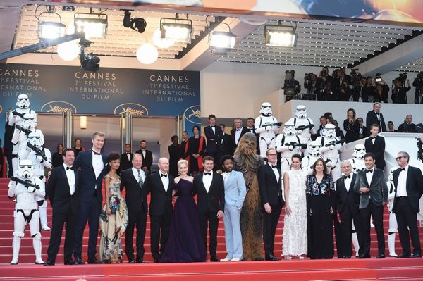 CANNES, FRANCE - MAY 15: (L-R) Producer Simon Emanuel, actor Joonas Suotamo, actress Thandie Newton, actor Woody Harrelson, director Ron Howard, actress Emilia Clarke, actor Alden Ehrenreich, actor Donald Glover, Chewbacca, Paul Bettany and Phoebe Waller-Bridge and members of the cast, attend the European Premiere of 'Solo: A Star Wars Story' at Palais des Festivals on May 15, 2018 in Cannes, France. (Photo by Antony Jones/Getty Images for Disney) *** Local Caption *** Simon Emanuel;Joonas Suotamo;Thandie Newton;Woody Harrelson;Ron Howard;Emilia Clarke;Alden Ehrenreich;Donald Glover;Chewbacca;Paul Bettany;Phoebe Waller-Bridge