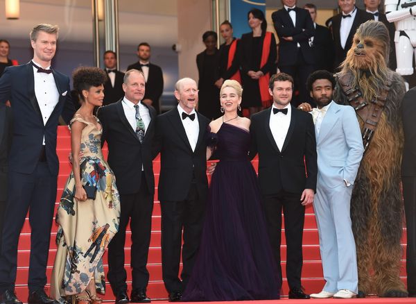 CANNES, FRANCE - MAY 15: (L-R) Producer Simon Emanuel, actor Joonas Suotamo, actress Thandie Newton, actor Woody Harrelson, director Ron Howard, actress Emilia Clarke, actor Alden Ehrenreich, actor Donald Glover and Chewbacca attend the European Premiere of 'Solo: A Star Wars Story' at Palais des Festivals on May 15, 2018 in Cannes, France. (Photo by Antony Jones/Getty Images for Disney) *** Local Caption *** Simon Emanuel;Joonas Suotamo;Thandie Newton;Woody Harrelson;Ron Howard;Emilia Clarke;Alden Ehrenreich;Donald Glover;Chewbacca