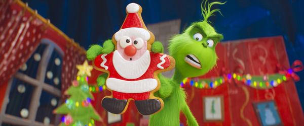 The Grinch (Benedict Cumberbatch) warns his dog Max and reindeer Fred about the seductive power of the Santa cookie as he trains them to help him steal Christmas in Dr. Seuss’ The Grinch from Illumination.